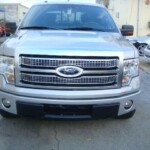 Before and after photographs of a damaged Ford pickup truck that was repaired by Elite Paint & Body Shop in West Palm Beach, Florida.